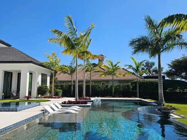 View of pool featuring patio surround and a fenced backyard