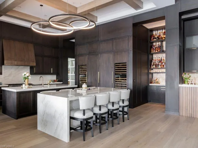 Kitchen with double island, 2 wine chillers, a backlight Cristalo bar, hidden wine cellar holding 900 bottles