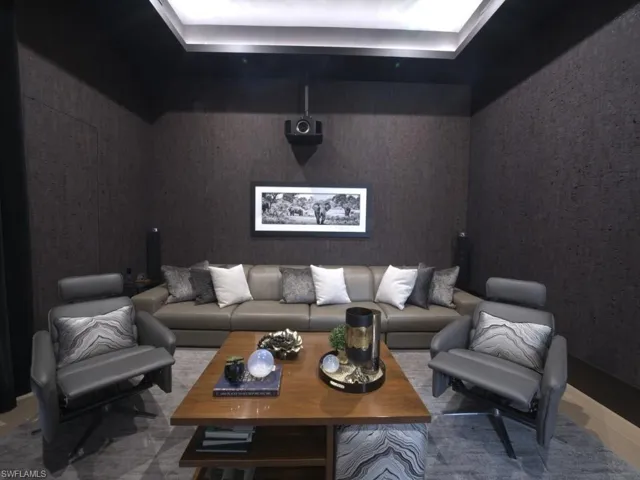 Sound proof cinema room, with electric reclining sofa and recliner chairs.