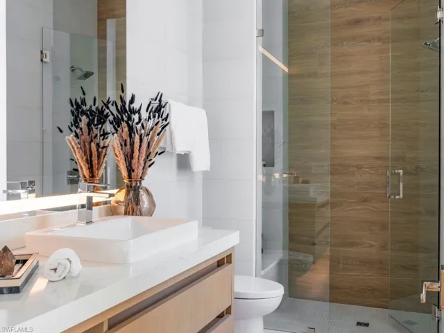 Bathroom 3 featuring a shower stall and vanity
