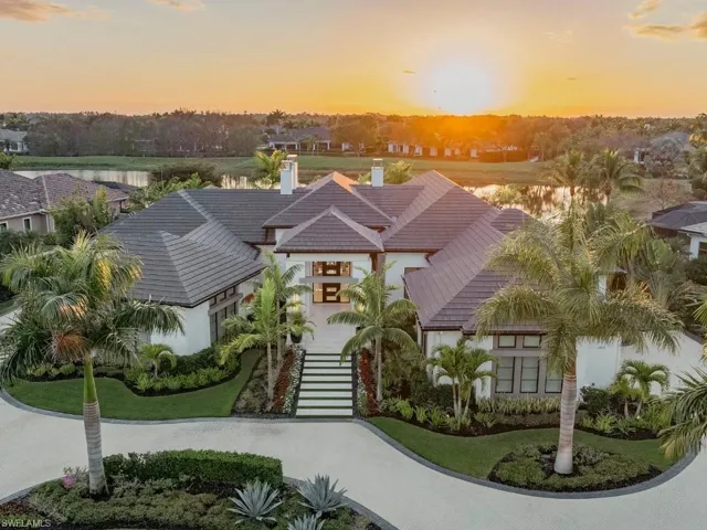 Front facade with circle paved driveway and tile roof