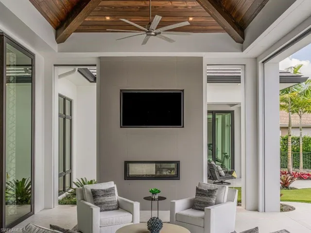 Outdoor living room with ceiling fan and outdoor lounge area