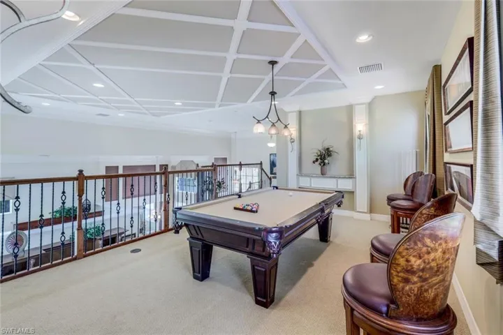 Playroom featuring light carpet and billiards