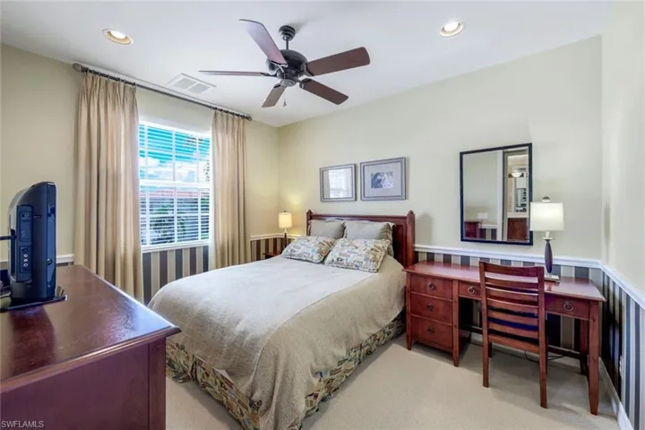 Bedroom featuring carpet and ceiling fan
