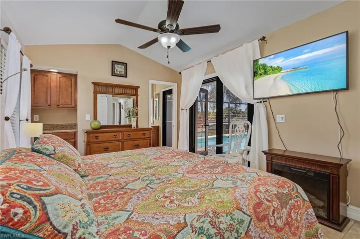 1st master bedroom with frenchdoors to pool
