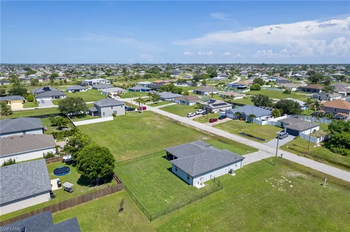 Aerial overview of property's location with nearby suburban area