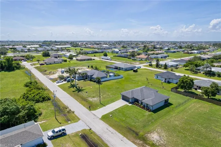 Aerial overview of property's location featuring nearby suburban area