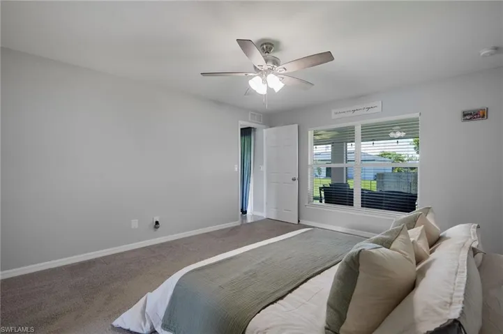 Bedroom featuring carpet floors and ceiling fan