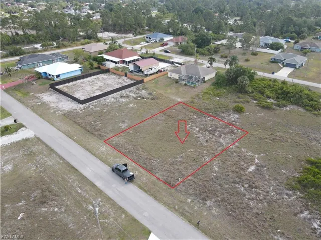 Aerial perspective of suburban area featuring property boundaries highlighted