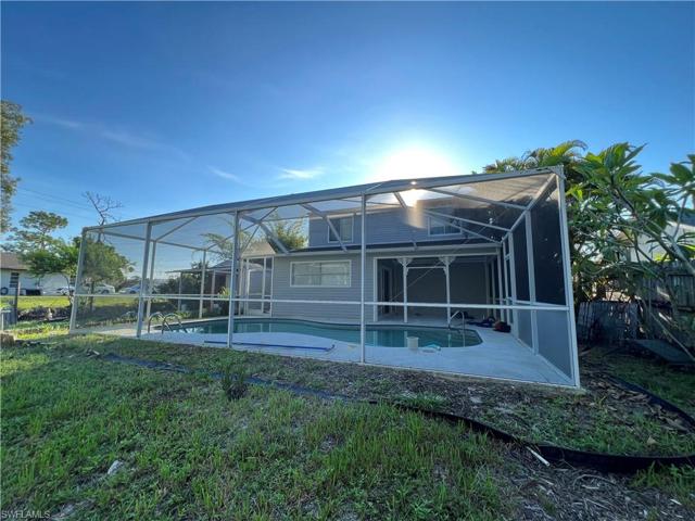View from backyard into lanai/pool