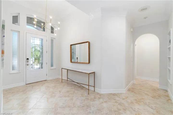 Spacious front Entry with high ceilings and tiled floors.