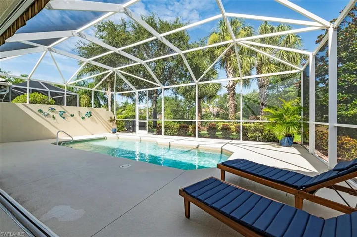 28864 Yellow Fin Trail Bonita Springs FL 34135 - Outdoor living features a powered awning.
