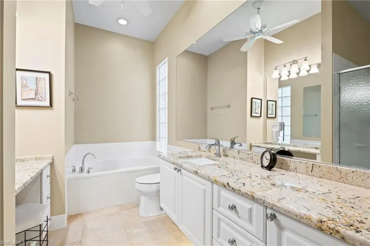 28864 Yellow Fin Trail Bonita Springs FL 34135 - Owner's bath has a soaking tub, separate vanities and separate commode areas.