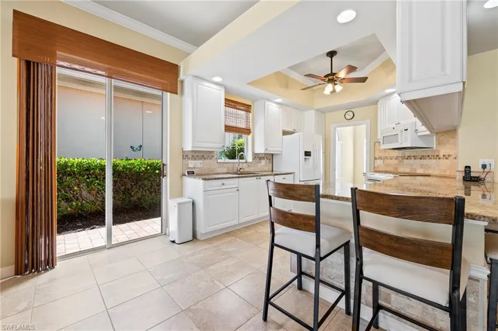 28864 Yellow Fin Trail Bonita Springs FL 34135 - Kitchen has slider access outside for easy grill access