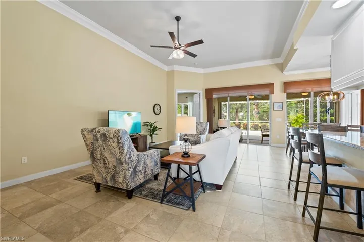 28864 Yellow Fin Trail Bonita Springs FL 34135 - Living area with tiled flooring and lighted ceiling fan