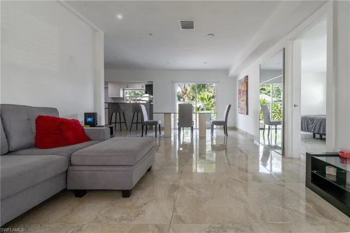 Living area with light marble finish floors
