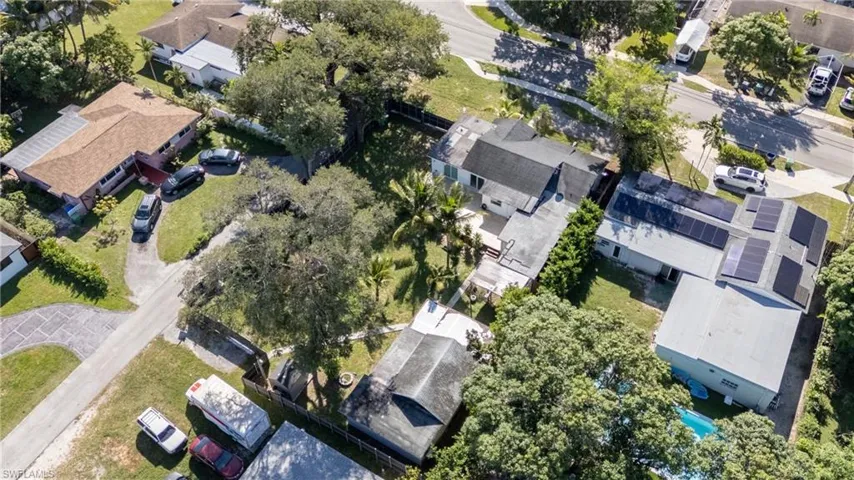 Aerial view of property's location with nearby suburban area