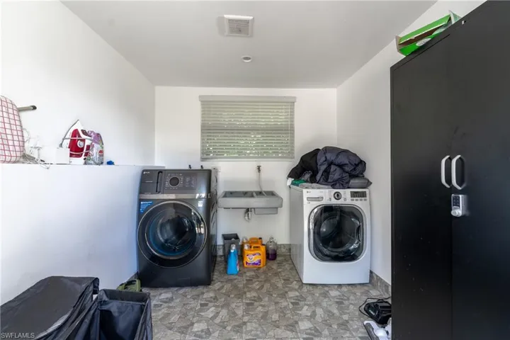 Washroom with washing machine and dryer