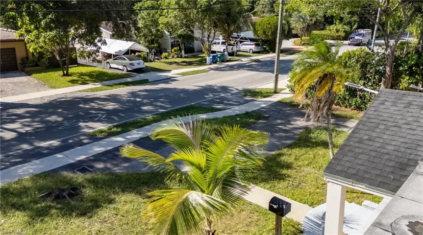 View of asphalt road with sidewalks