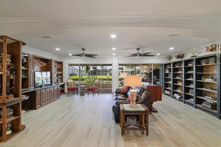 Great room with custom-built cabinets and shelves.