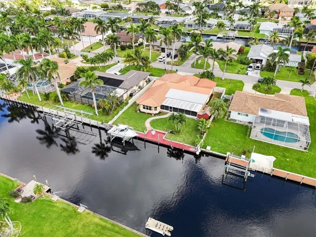 Aerial view of residential area featuring a large body of water