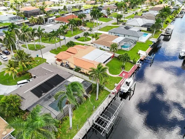Aerial perspective of suburban area with a nearby body of water
