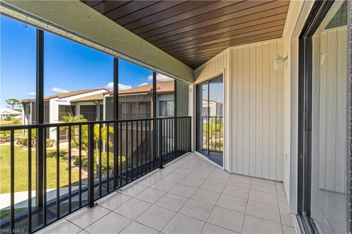 Unfurnished sunroom featuring wood ceiling