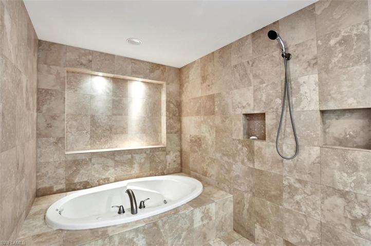 Primary Bedroom's soaking tub and shower