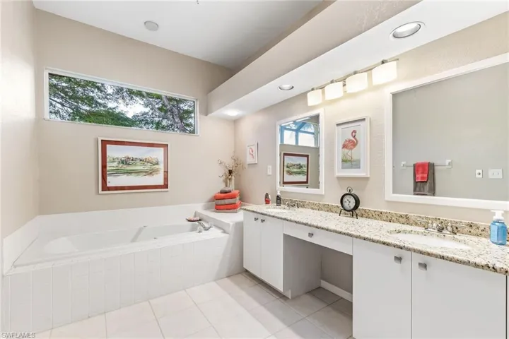 primary with soaking tub dual sinks