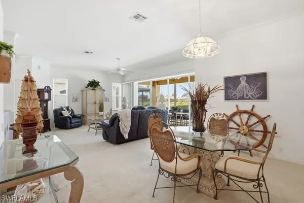 Dining and Living Room with Sliders to the Lanai/Pool.