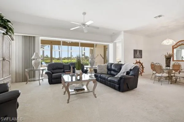 Living Room with Large Sliders to the Pool.