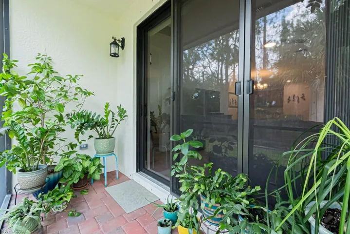 View of exterior entry with stucco siding