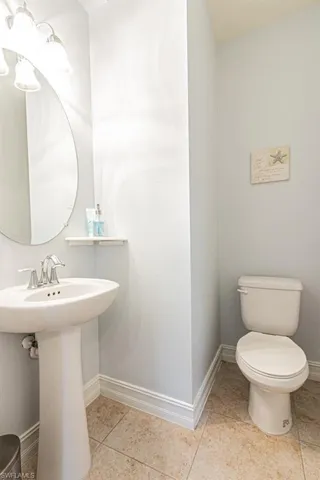 Bathroom featuring toilet and tile patterned floors