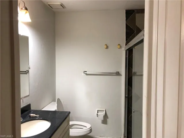 Full bathroom with vanity and a shower