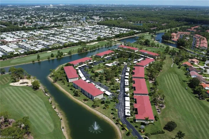 Aerial overview of property's location with a large body of water and nearby suburban area
