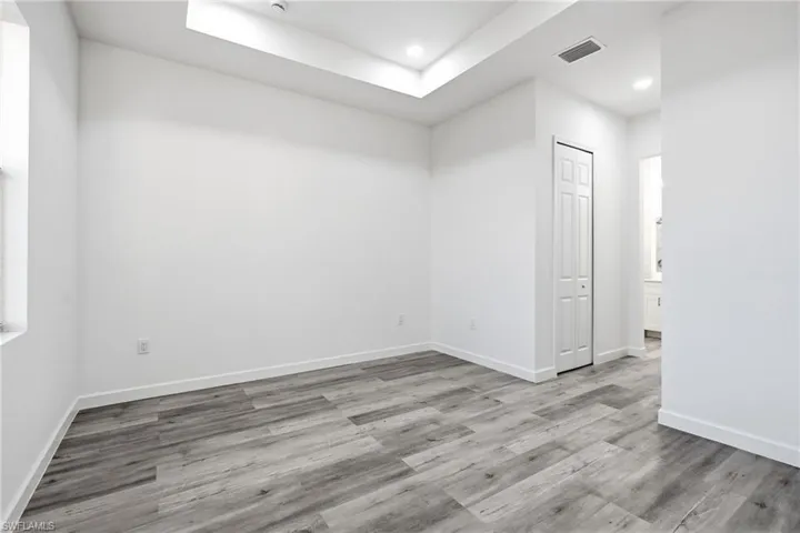 Spare room with recessed lighting and light wood-type flooring