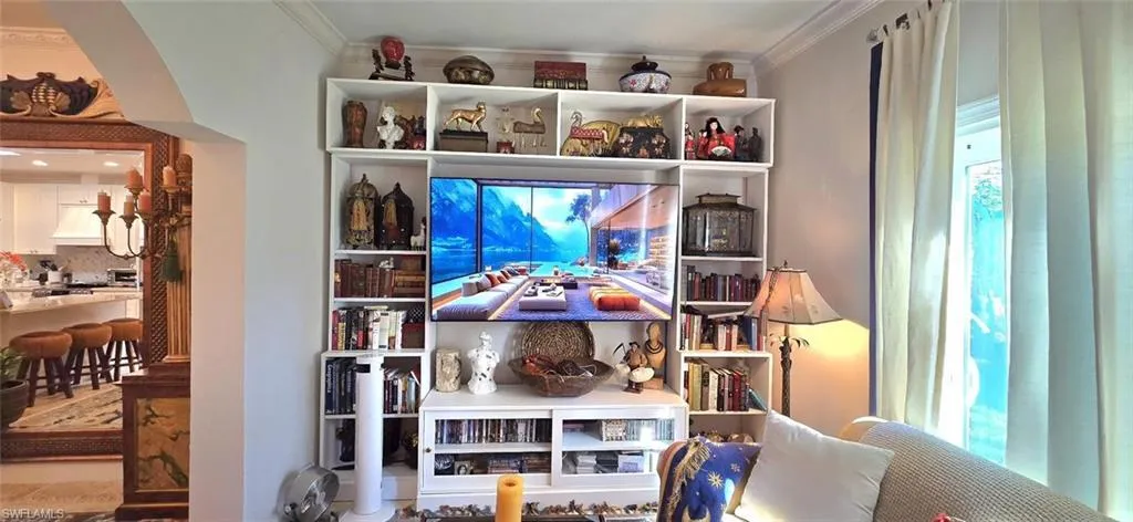 Detailed view of crown molding and custom range hood