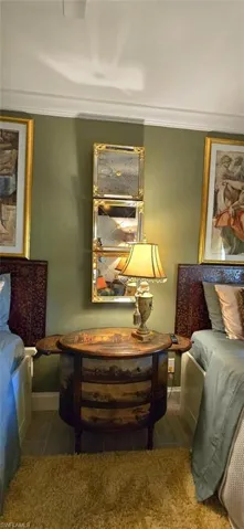 Bedroom featuring ornamental molding and baseboards