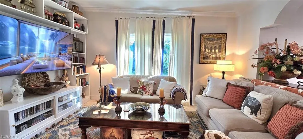 Living area featuring ornamental molding