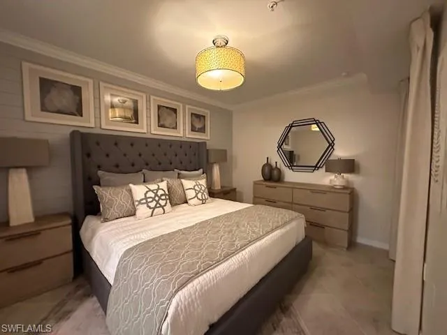 Bedroom with carpet and ornamental molding