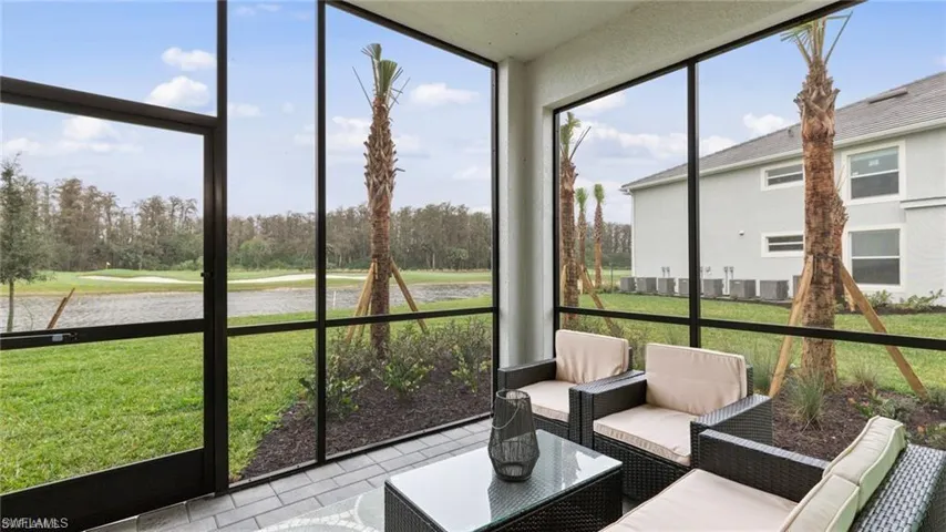 Sunroom / solarium featuring a healthy amount of sunlight