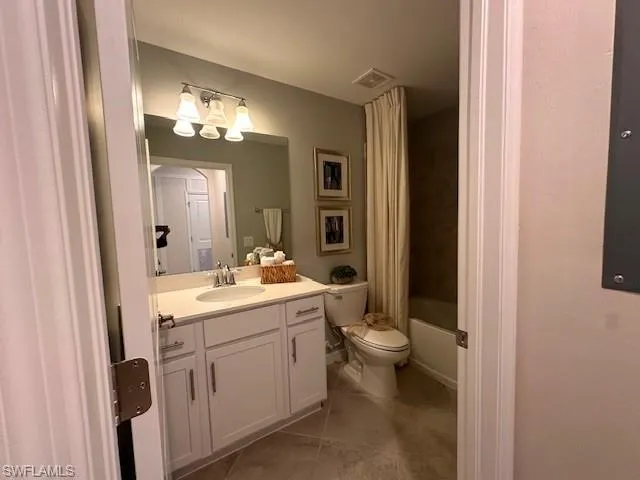 2nd Bedroom featuring connected bathroom, a closet, and ornamental molding
