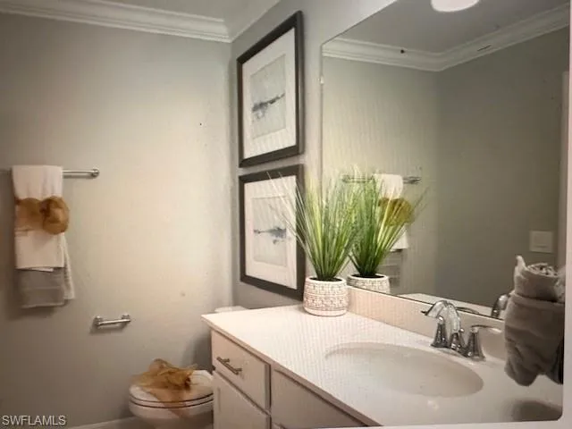 Full bathroom with toilet, tile patterned floors, vanity, and shower / tub combo with curtain