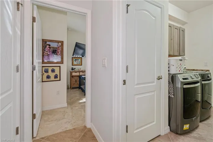 Laundry area with washer and dryer and cabinet space