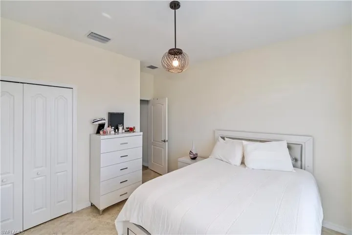 Bedroom with a closet and baseboards