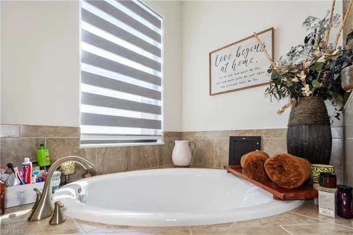 Full bathroom with a bath