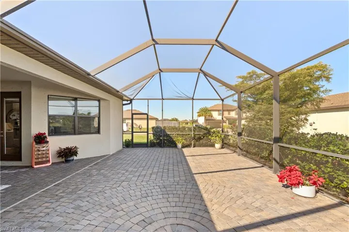 View of patio / terrace with glass enclosure and a sunroom