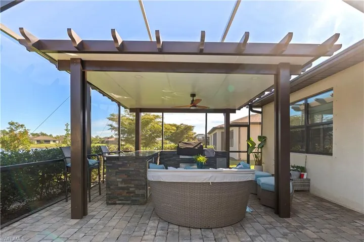 View of patio / terrace with a ceiling fan, an outdoor hangout area, and a sunroom