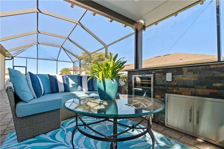 View of patio / terrace with outdoor dining area, exterior kitchen, a lanai, a sunroom, and an outdoor hangout area