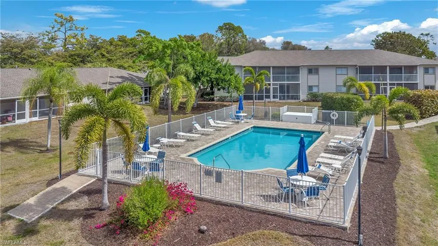 Community pool with a patio